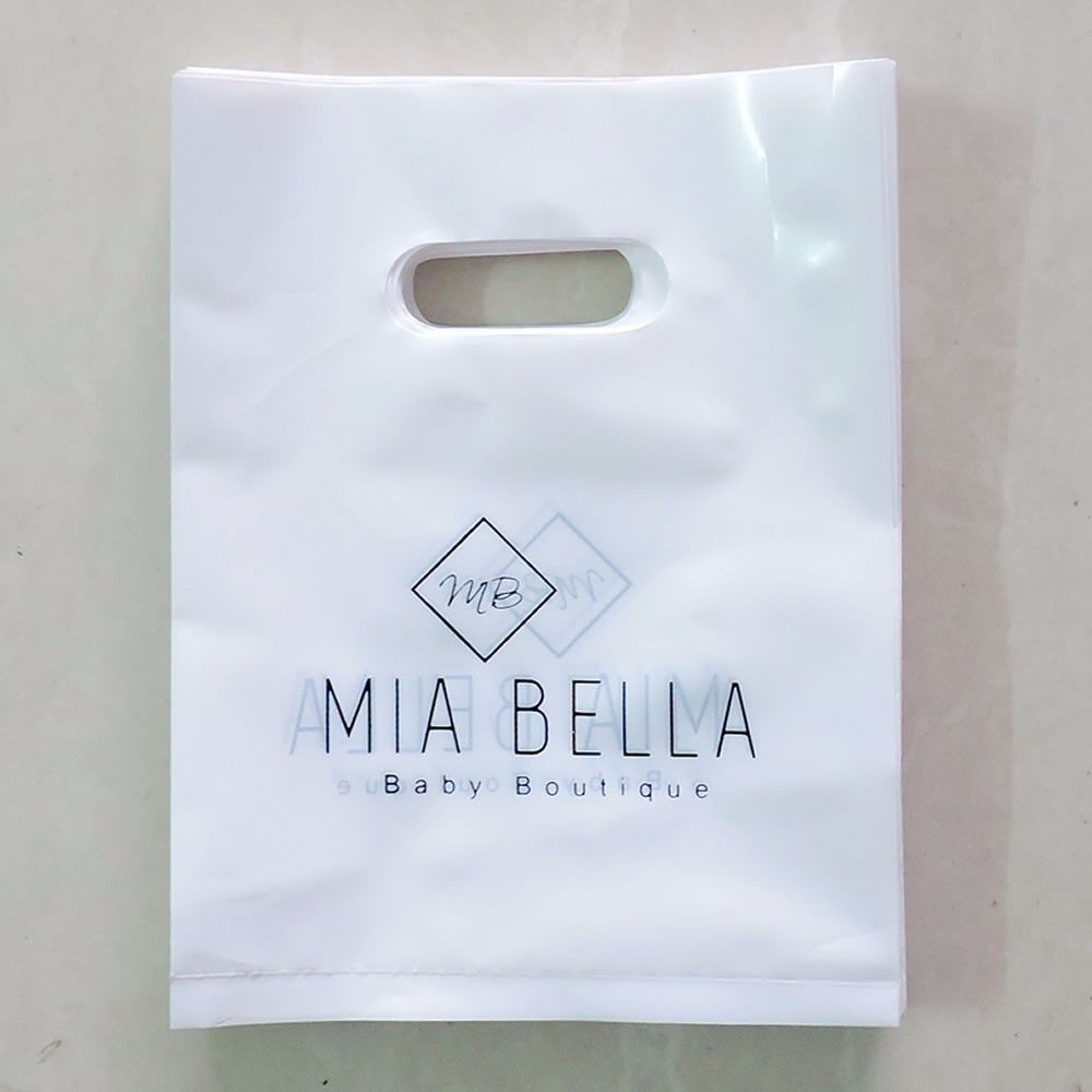Frosted plastic bags with soft loop handles and bottom gussets for retail packaging