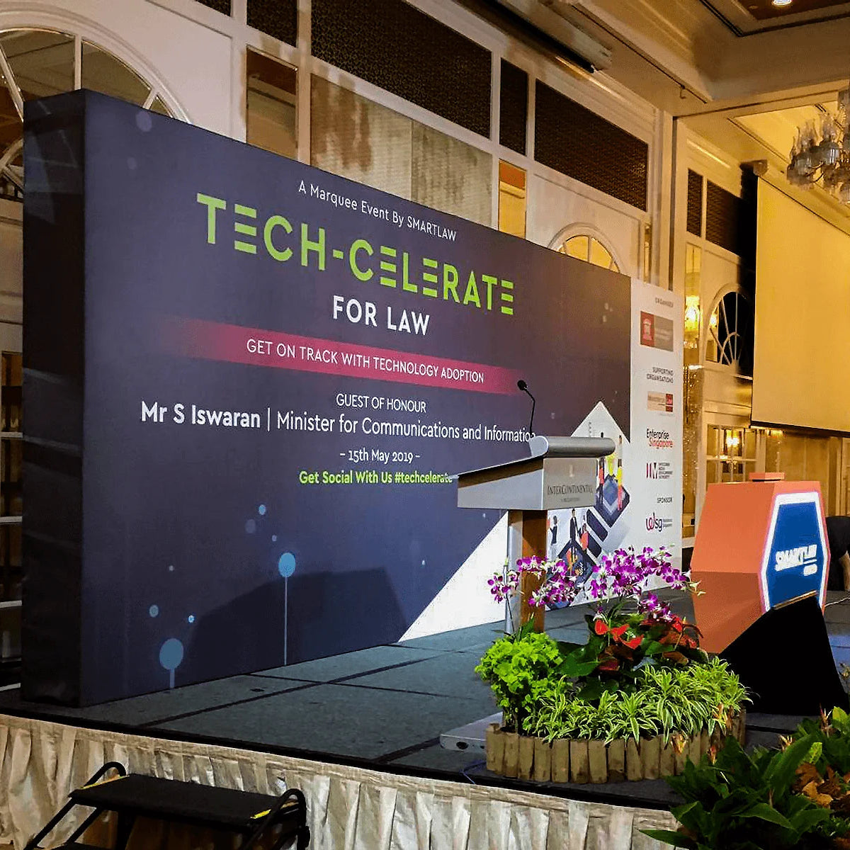 Freestanding indoor conference stage backdrop with custom event branding for Tech-Celerate for Law event by Formset Advertising.