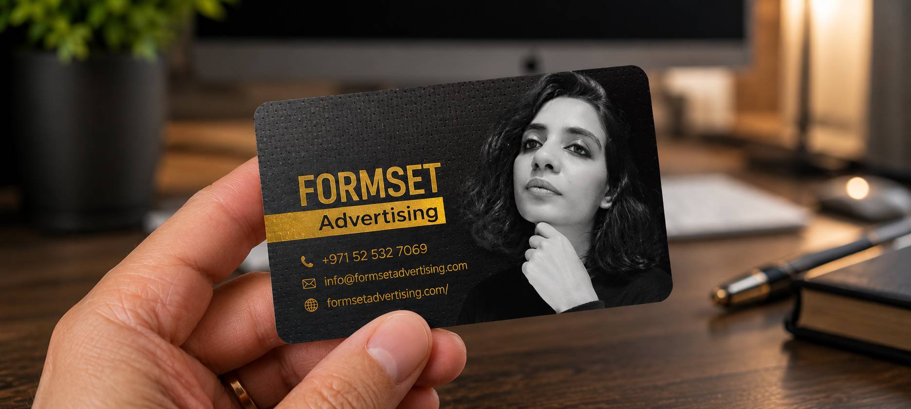 Premium custom business cards printed by Formset Advertising showing gold foil and embossed details on thick cardstock