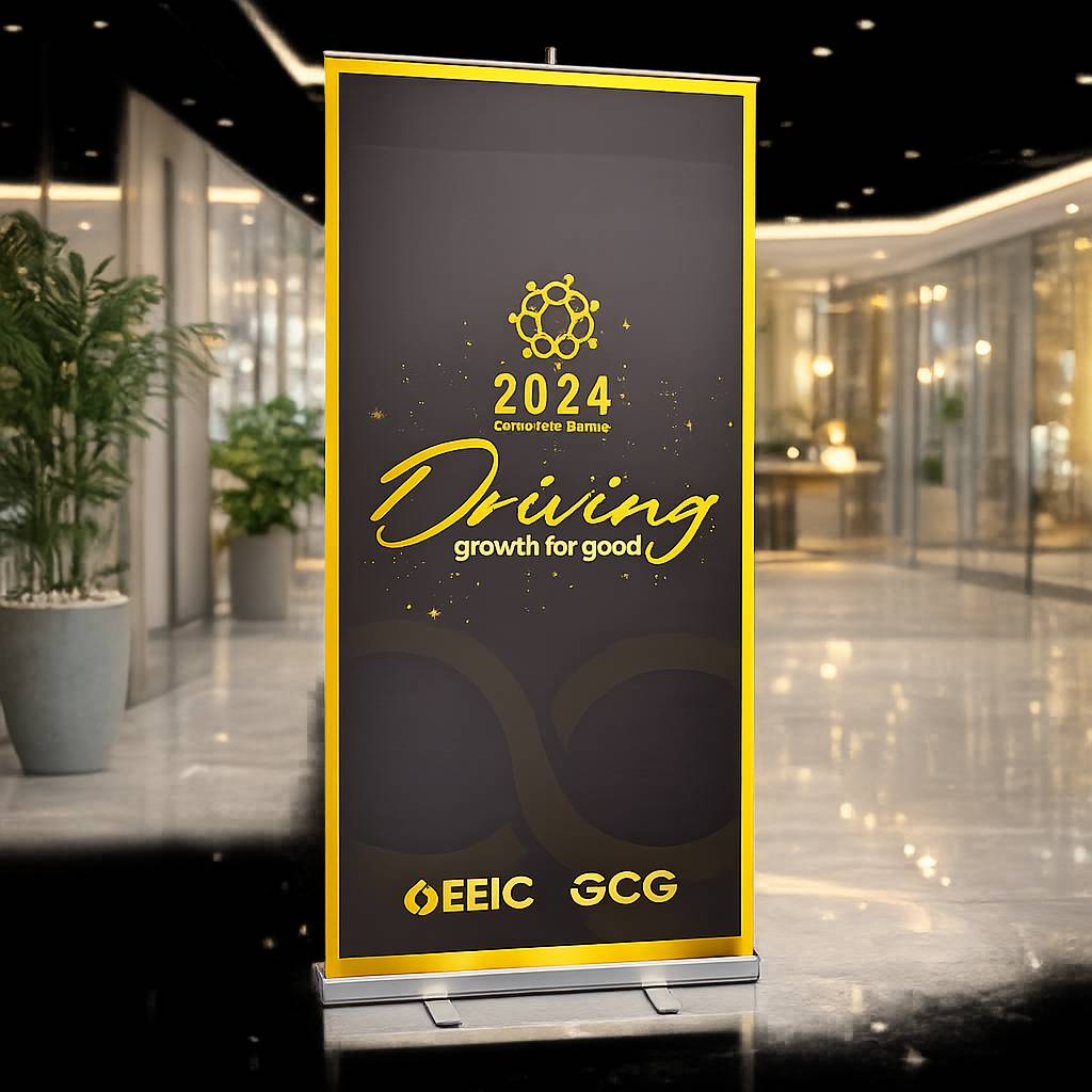 Custom printed roll-up banner stand displayed at a trade show in Dubai with vibrant branding and heavy duty aluminum base